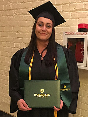 Sarah Kaeding holding diploma