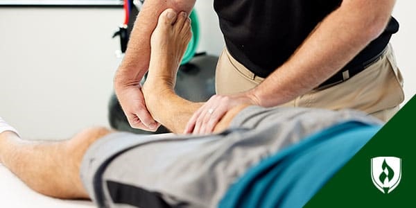 photo of a pta lifting a patient's leg representing how to become a physical therapist assistant (and why you should)