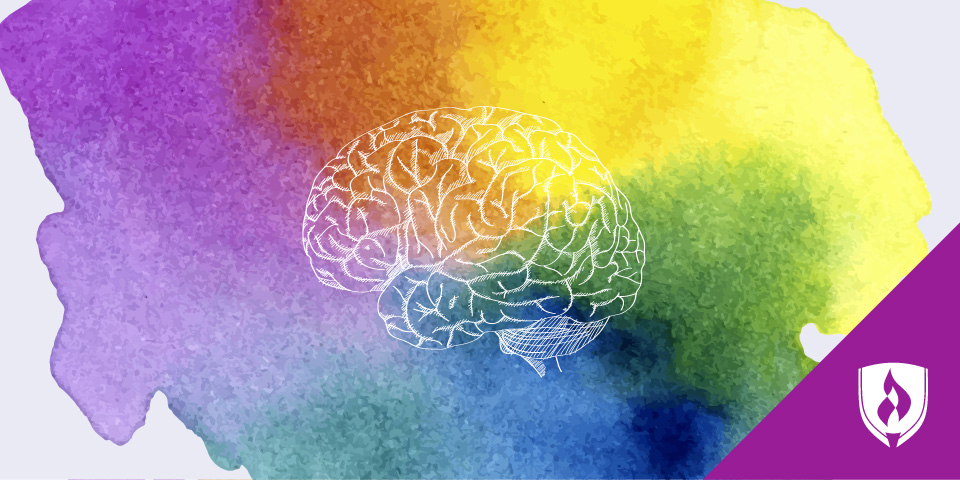 illustrated brain over colorful watercolors