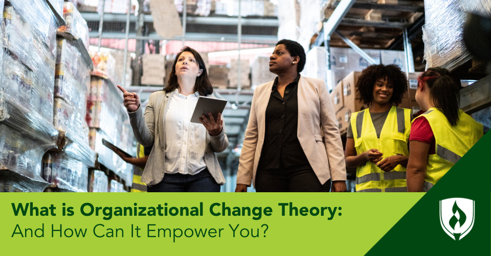 Two female managers walk through a warehouse discussing plans