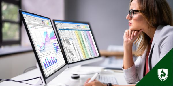 A manager looks over spreadsheets
