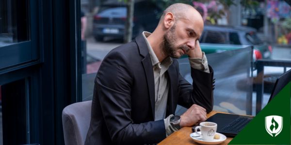 A job seeker sits at a computer trying to enter information into the ATS