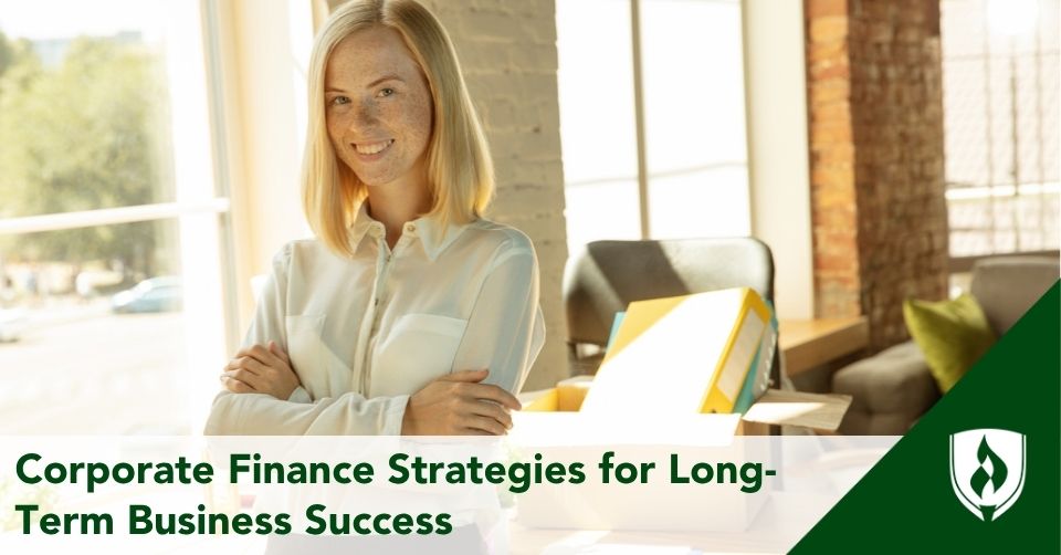 A corporate finance consultant folds her arms in front of a sunny office