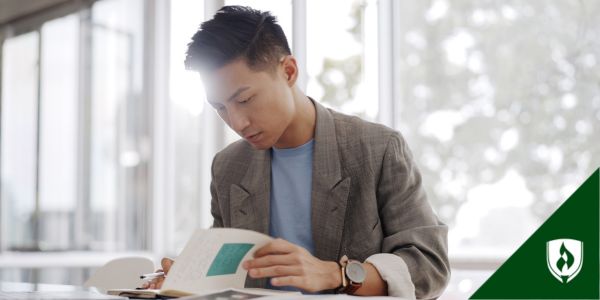 A file clerk looks through hardcopy documents