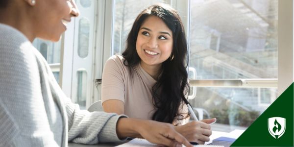 A graphic designer works with a client