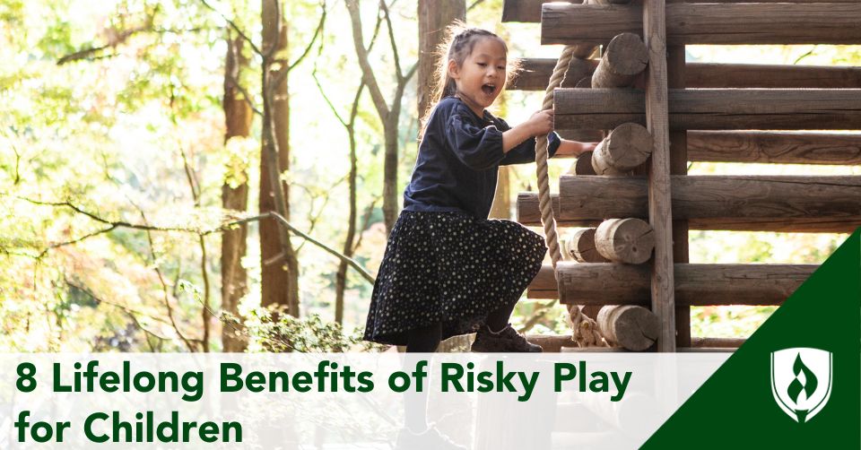 A child climbs up a log structure