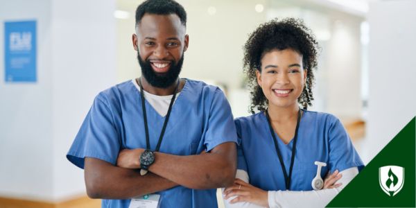 An occupational therapist and physical therapist stand in their hospital