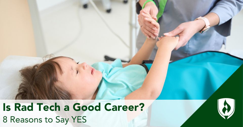 A rad tech holds a child's hands on the bed of a diagnostic scanning machine