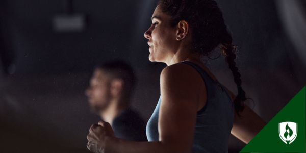 Two police academy recruits run on treadmills