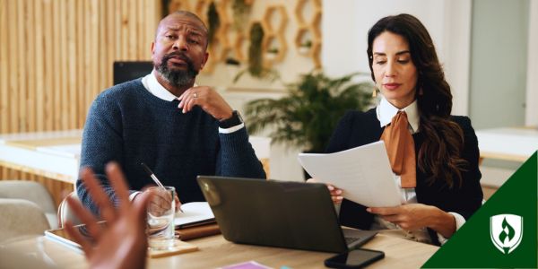 Two corporate lawyers meet with a stakeholder