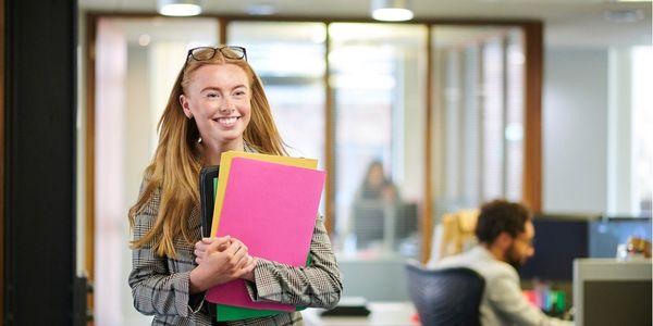 Paralegal holding documents