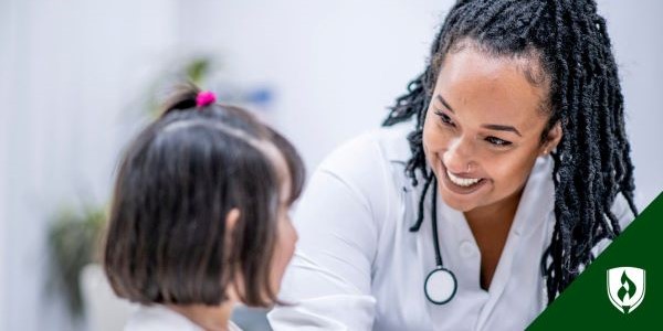 A nurse practitioner checks in on a little girl