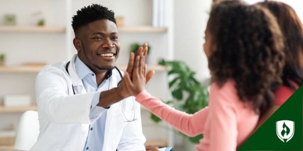 An FNP high fives one of his patients