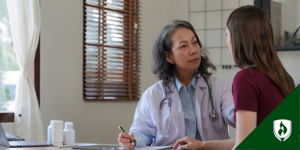 A nurse practitioner meets with a patient as ambient AI takes a transcript