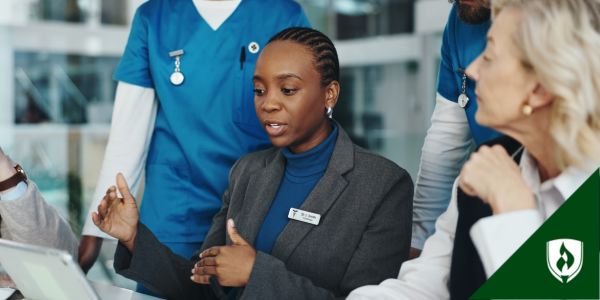 A director of nursing meets with medical staff and leadership