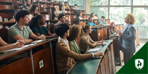 A DNP nurse stands in front of a lecture hall