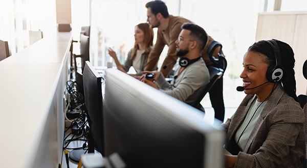 Network specialists working in front of computers