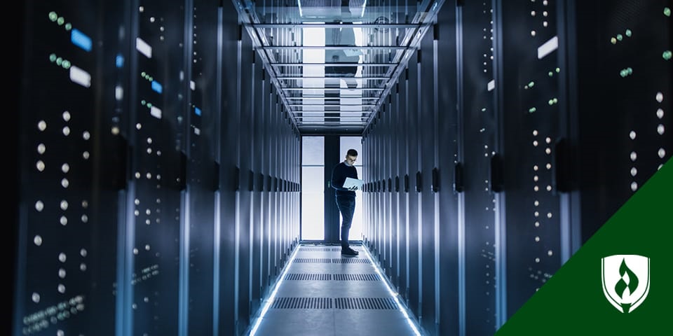 tech professional standing in server room