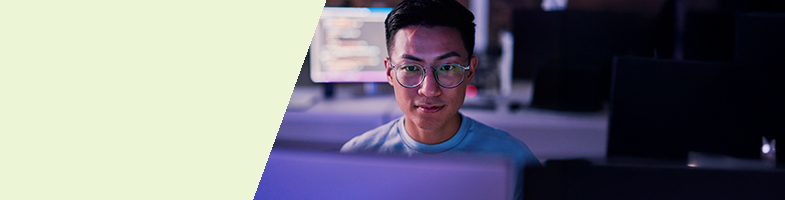 Cyber Security professional sitting behind a monitor